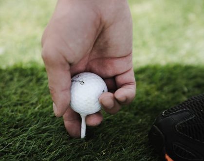 Person Holding Golf Ball