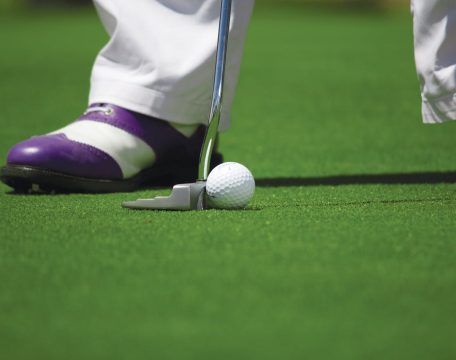 Person in White Pants Playing Golf